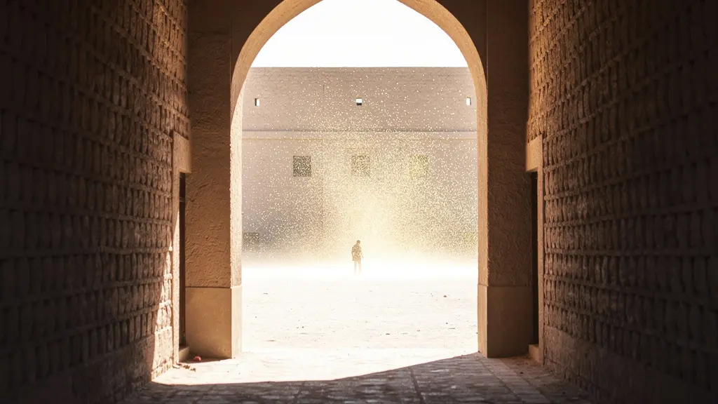 Stark contrast between blazing sunlit battlements and deep cool shadows within fort archways at midday